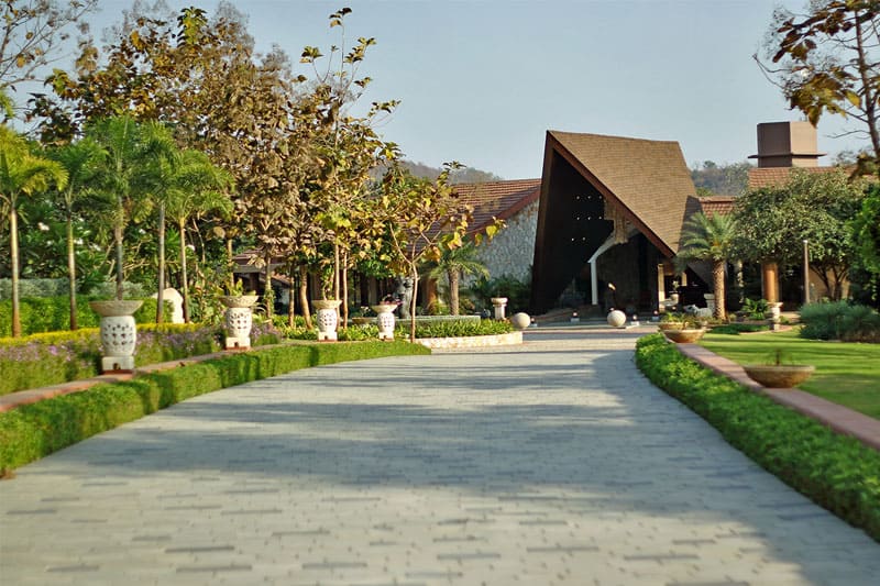 a paved path leading to a building